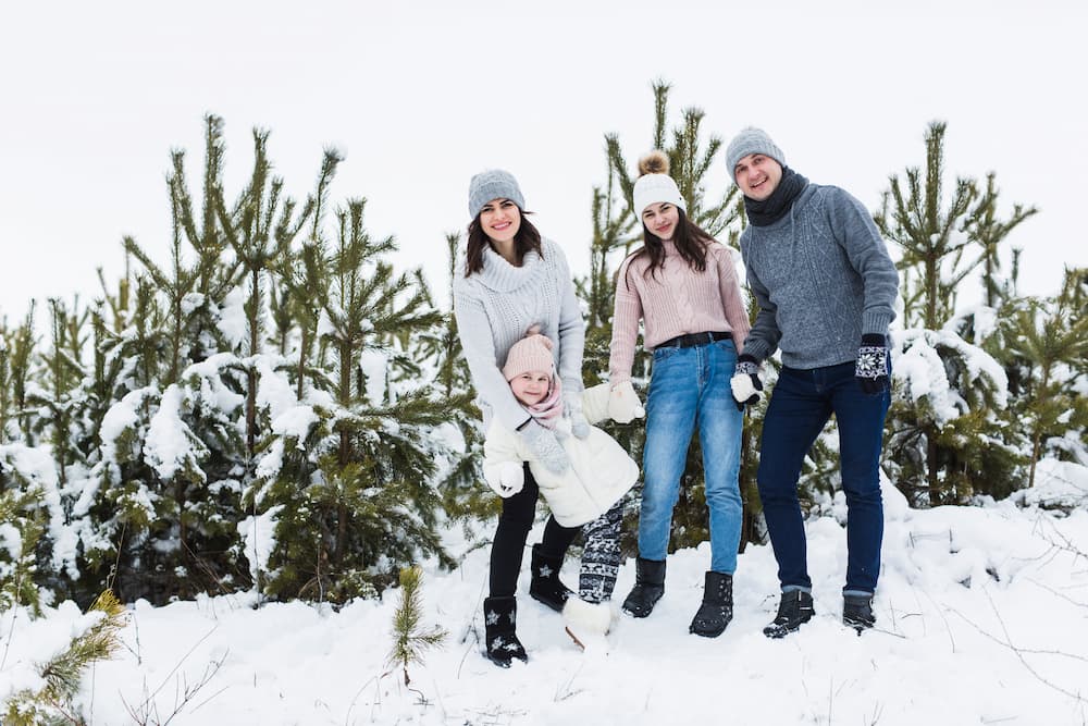 Muslim family enjoying snow activities at Rohtang Pass near Manali