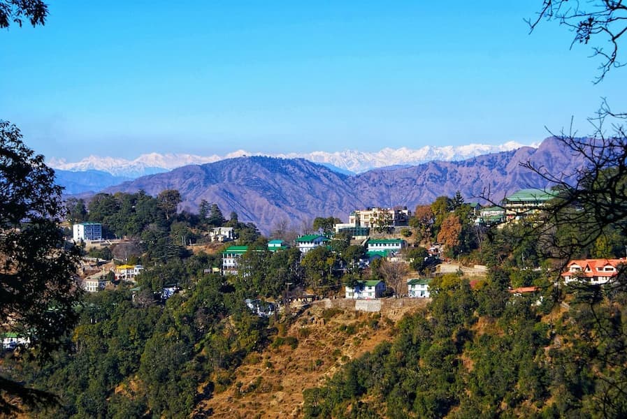 Muslim family enjoying panoramic views of the misty green hills of Mussoorie