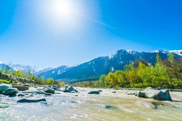 Muslim family enjoying green meadows in Pahalgam, Kashmir