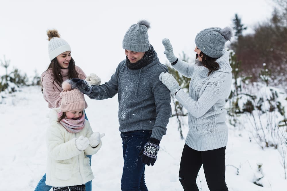 Muslim family enjoying snow activities at Rohtang Pass on the Shimla Manali Chandigarh Tour