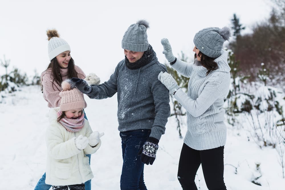 Muslim family enjoying snow activities at Rohtang Pass near Manali
