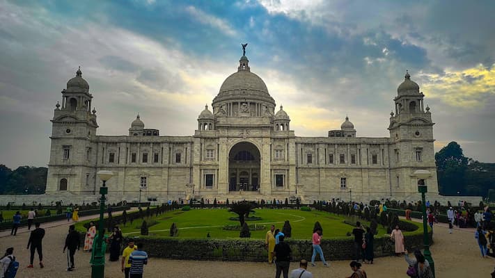 Muslim family exploring the Victoria Memorial's colonial architecture in Kolkata