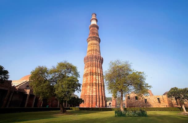 Muslim family at Qutub Minar, a UNESCO World Heritage Site featured in this Delhi Halal Travel Guide