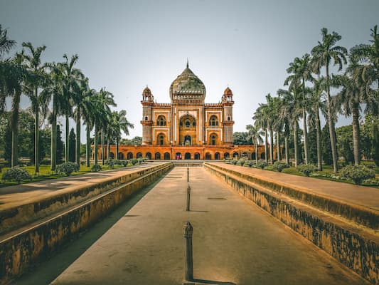 Muslim travelers exploring Safdarjung's Tomb, an Indo-Islamic monument near Lodi Gardens in Delhi